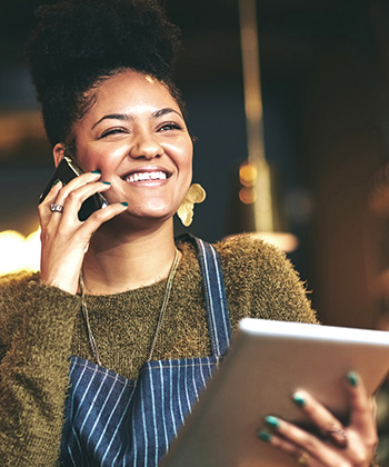 waitress using a phone and tablet